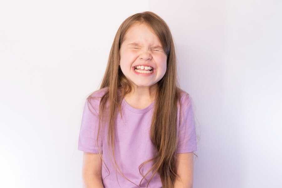 lovely-little-girl-lilac-undershirt-with-flowing-hair-having-strongly-blinked_496756-7540.jpg