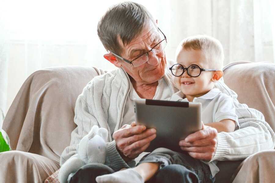 elderly-grandfather-his-little-grandson-use-tablet-device_266247-1759.jpg